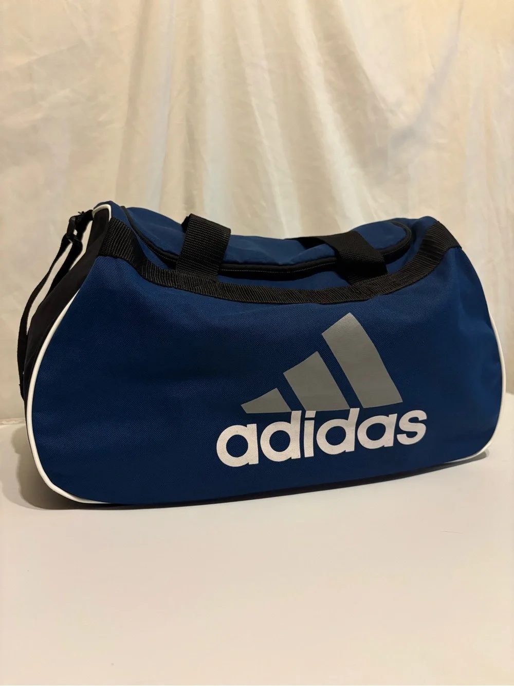 adidas Blue Duffel Bag with White Logo and Trim Shoulder Strap and Short Handle